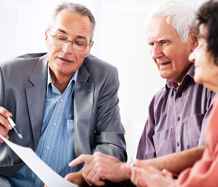 Senior couple meeting with financial adviser