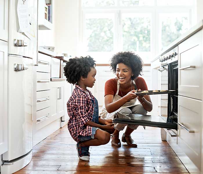 Mother and daughter enjoying cooking together